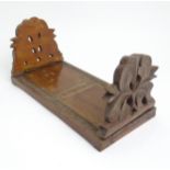 A carved book slide with floral and foliate detail. 12" approx. unextended. Please Note - we do