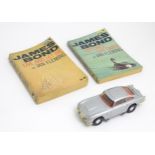 A Corgi Toys James Bond 007 Aston Martin DB5. Together with two James Bond books Live and Let Die,