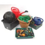 A quantity of assorted gardening tools and equipment to include watering cans, hose, trowel, plant