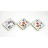 Three Limoges ceramic pin dishes / ashtrays of square form decorated with flowers marked Gucci.