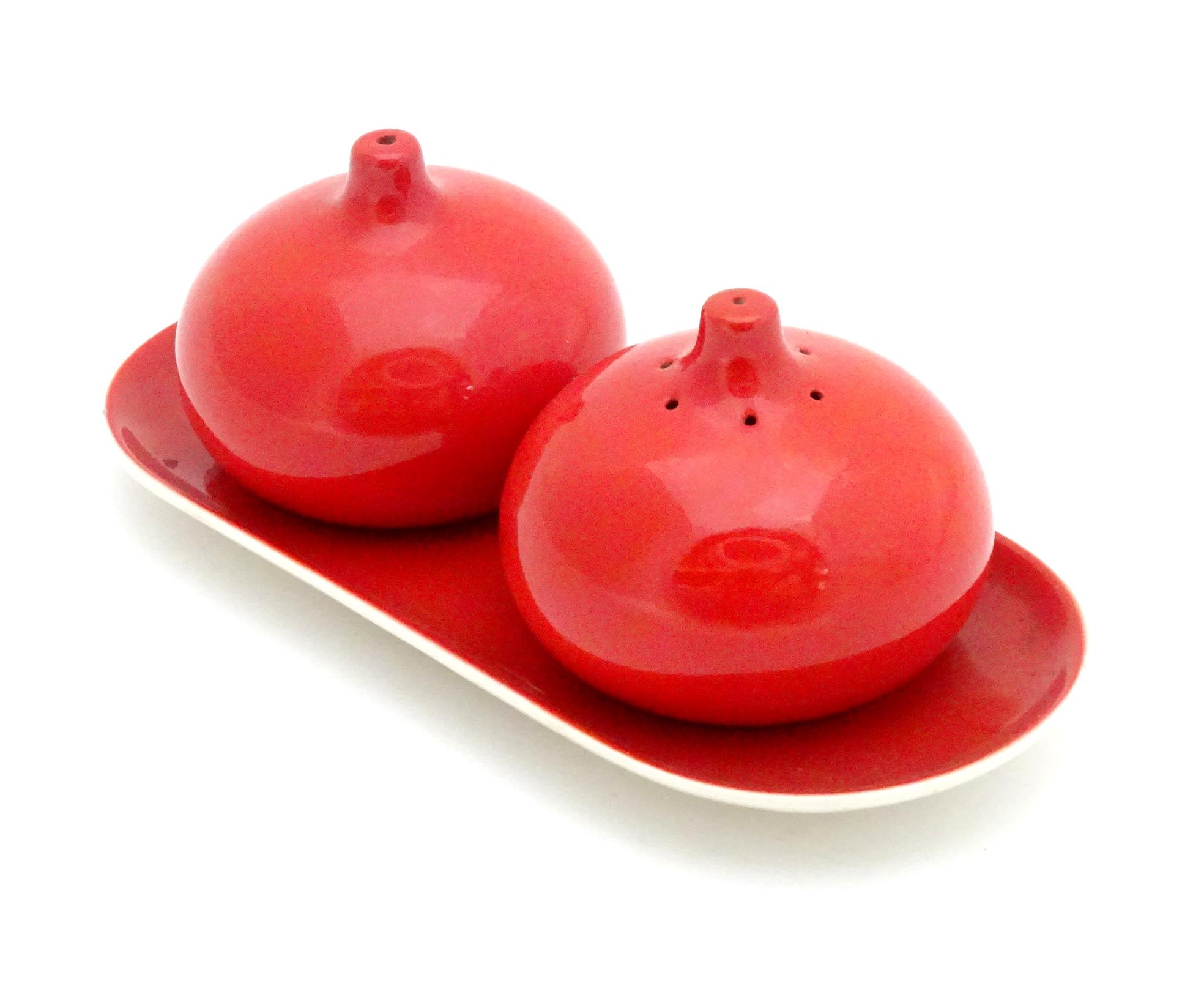 A Carlton Ware cruet set on stand with a red glaze. Marked and impressed under 2955 Please Note - we