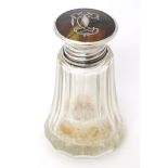 A glass salts / scents bottle, the silver and tortoiseshell lid with pique work decoration,