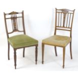 Two Edwardian rosewood chairs, having inlaid and pierced backrests. 35" and 34" high. Please