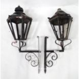 Two cast exterior lanterns with scroll brackets. Approx. 39" high (2) Please Note - we do not make