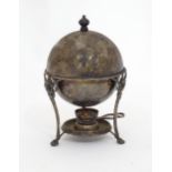 A silver plate egg coddler with burner under. Please Note - we do not make reference to the