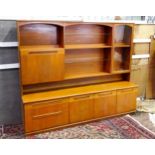 Vintage / Retro: A Meredew two sectional teak sideboard, the top section having fitted shelves, a