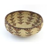 Ethnographic / Native / Tribal: An African woven basket. Approx 9" diameter Please Note - we do