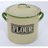 A flour tin with enamel detail. Approx 9" high Please Note - we do not make reference to the