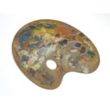An artist's palette board. 14" wide Please Note - we do not make reference to the condition of