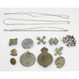 A quantity of scrap silver and white metal jewellery together with various brooches, badges, etc.