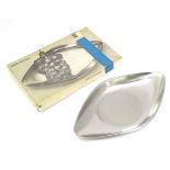 A stainless steel serving dish by WMF, boxed. Approx. 6 1/2" x 11 1/4" Please Note - we do not