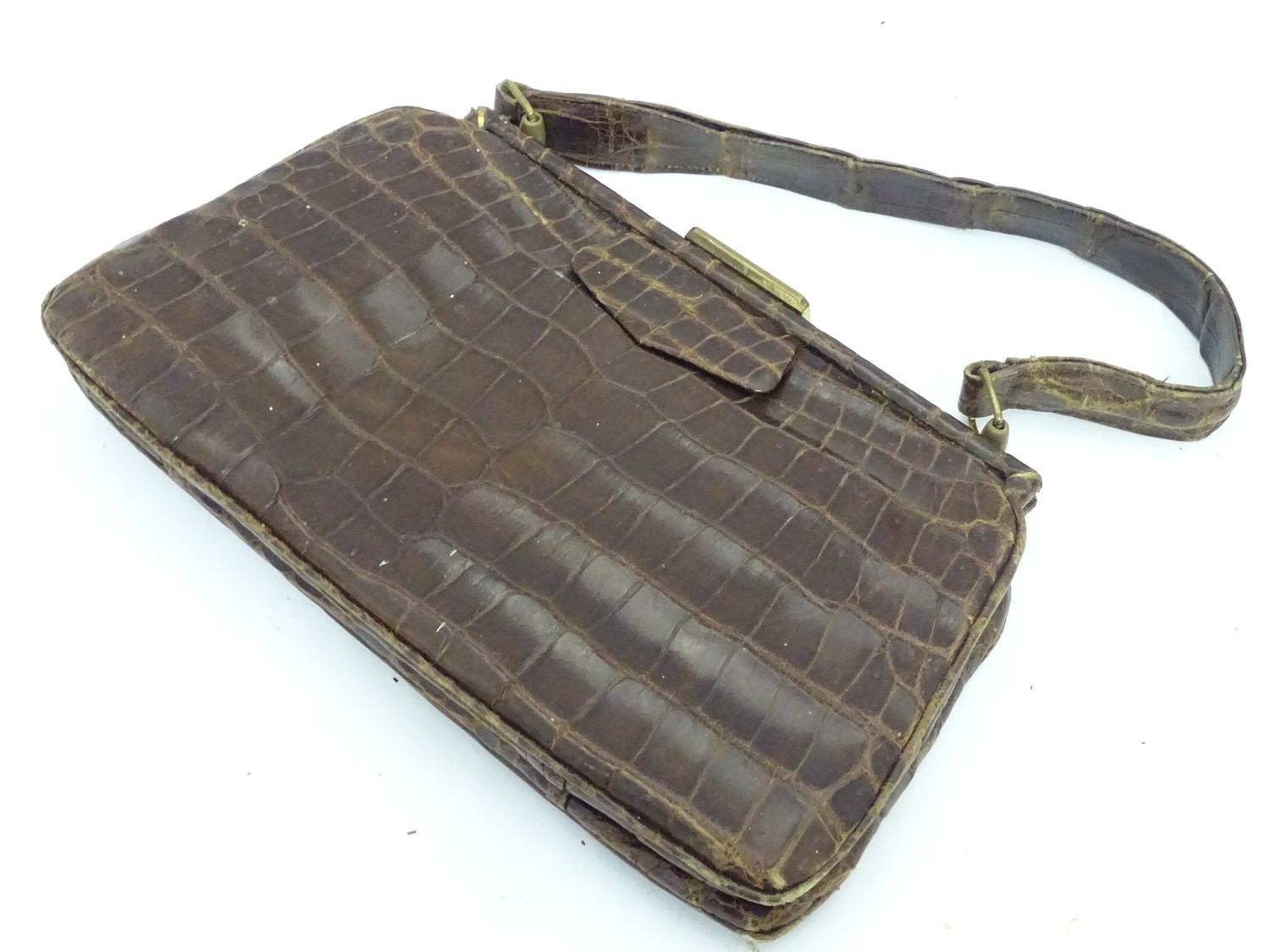 A vintage crocodile handbag with purse and mirror Please Note - we do not make reference to the
