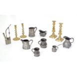 A quantity of assorted pewter and brass wares, to include candlesticks, tankards, etc. Please Note -
