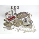 A quantity of assorted silver plated wares to include various trays, flatware, candelabra, milk jug,