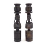 A pair of hardwood tribal figural candlesticks. Approx.10 1/4" high Please Note - we do not make