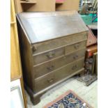 An 18thC oak bureau with fall front over two short over two long drawers with swan neck handles. The