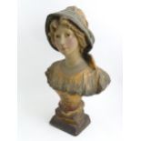 After Richard Aurili (1834-1914), An Italian plaster bust depicting a young lady wearing a hat, with