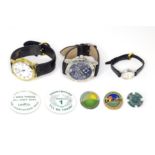 Three various wrist watches with quartz movements. Together with Countryside Alliance badges,