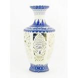 A Chinese two-sectional blue and white vase, the inner section decorated with deer in a landscape,