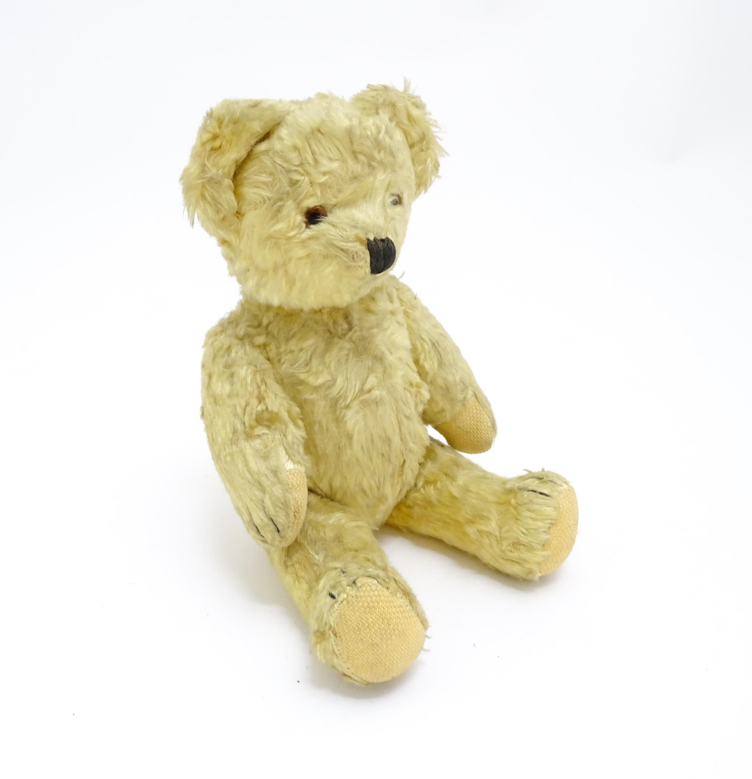 Toy: A 20thC straw filled teddy bear with stitched nose, mouth, and claws, pad paws and - Bild 2 aus 9