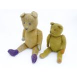 Toys: An early 20thC straw filled teddy bear with glass eyes, stitched nose and mouth and growler