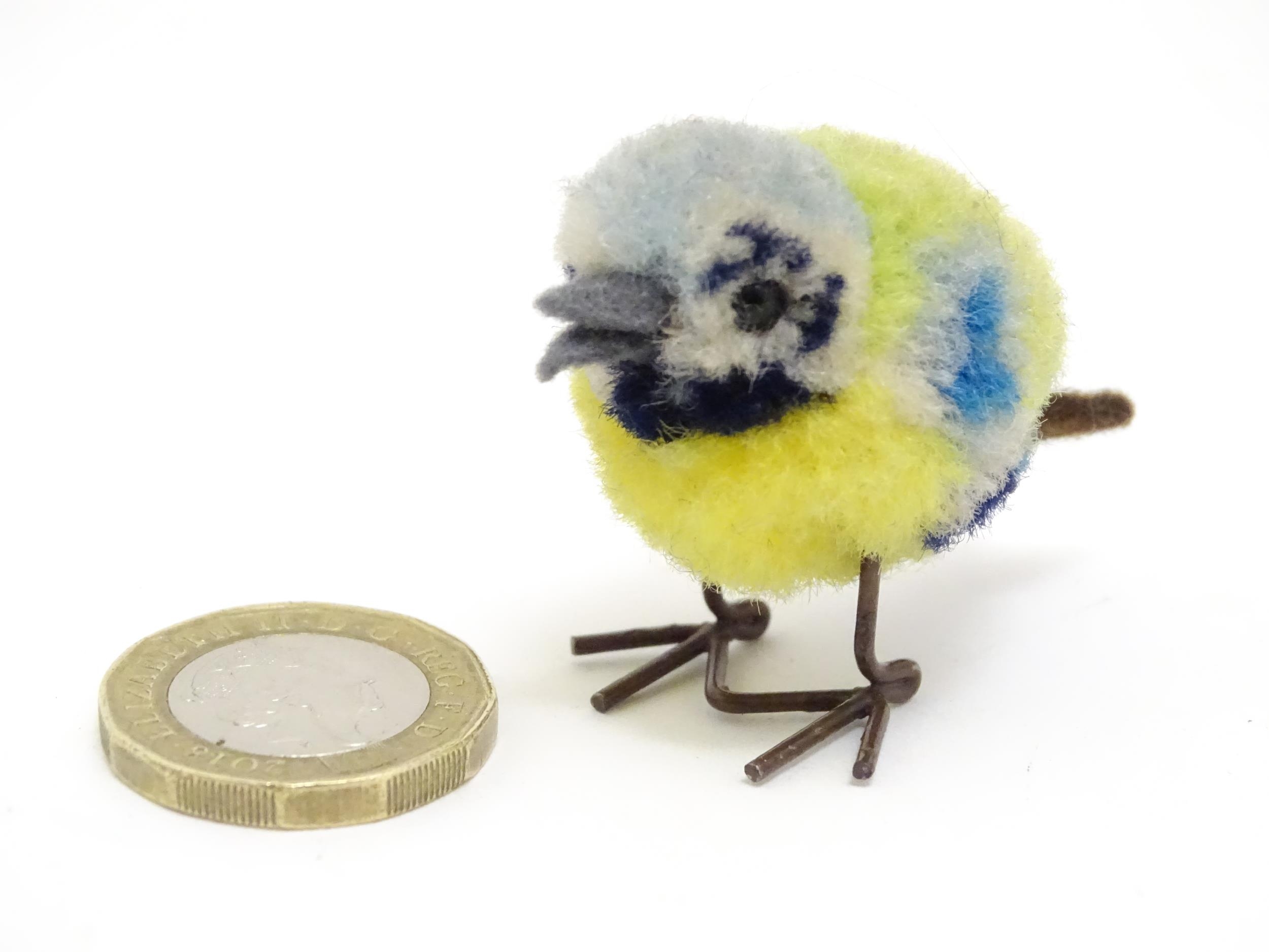 Toy: An early 20thC Steiff woollen model of a miniature blue tit bird, with felt tail and beak and