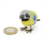 Toy: An early 20thC Steiff woollen model of a miniature blue tit bird, with felt tail and beak and