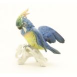 A Karl Ens model of a Parrot / Cockatoo perched on a branch. Marked under. Approx. 9" high Please