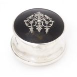 A silver ring box with hinged lid having domed tortoiseshell and pique work decoration, hallmarked