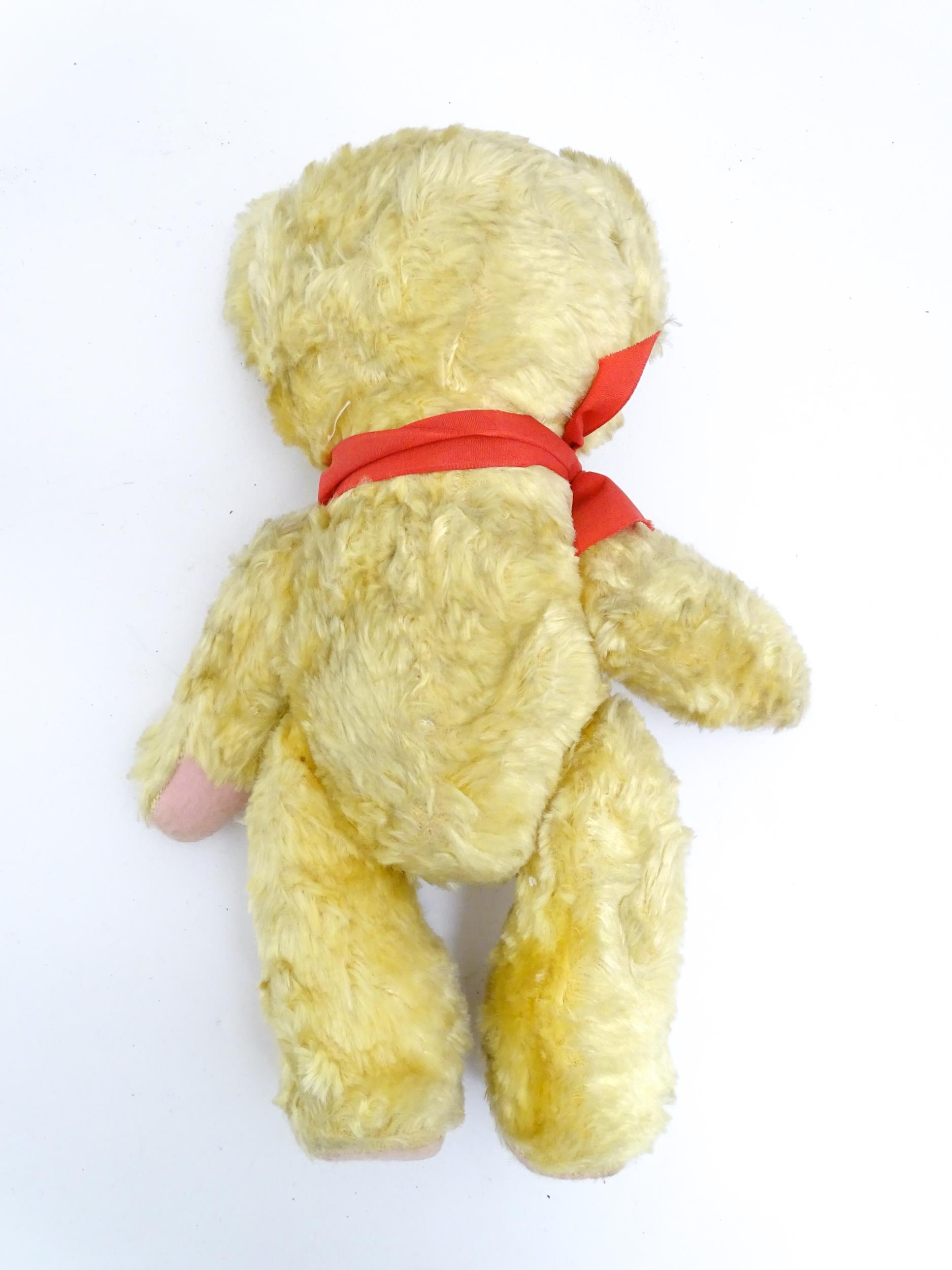 Toy: A 20thC plush teddy bear with scrolled nose, pad paws and articulated limbs. Approx. 11" long - Bild 8 aus 8