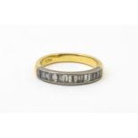 An 18ct gold half eternity ring set with 15 baguette cut diamonds. Ring size approx. M 1/2 Please