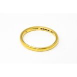 A 22ct gold ring, retailed by Bravingtons. Ring size approx. N Please Note - we do not make