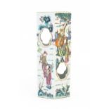 A Chinese famille rose hat stand of hexagonal form decorated with scholar figures in a landscape,