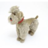 Toy: A 20thC Steiff mohair soft toy modelled as a Poodle dog - Snobby, with felt tongue, articulated