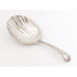 A Geo III silver caddy spoon with shell formed bowl, hallmarked London 1802 maker George Wintle.