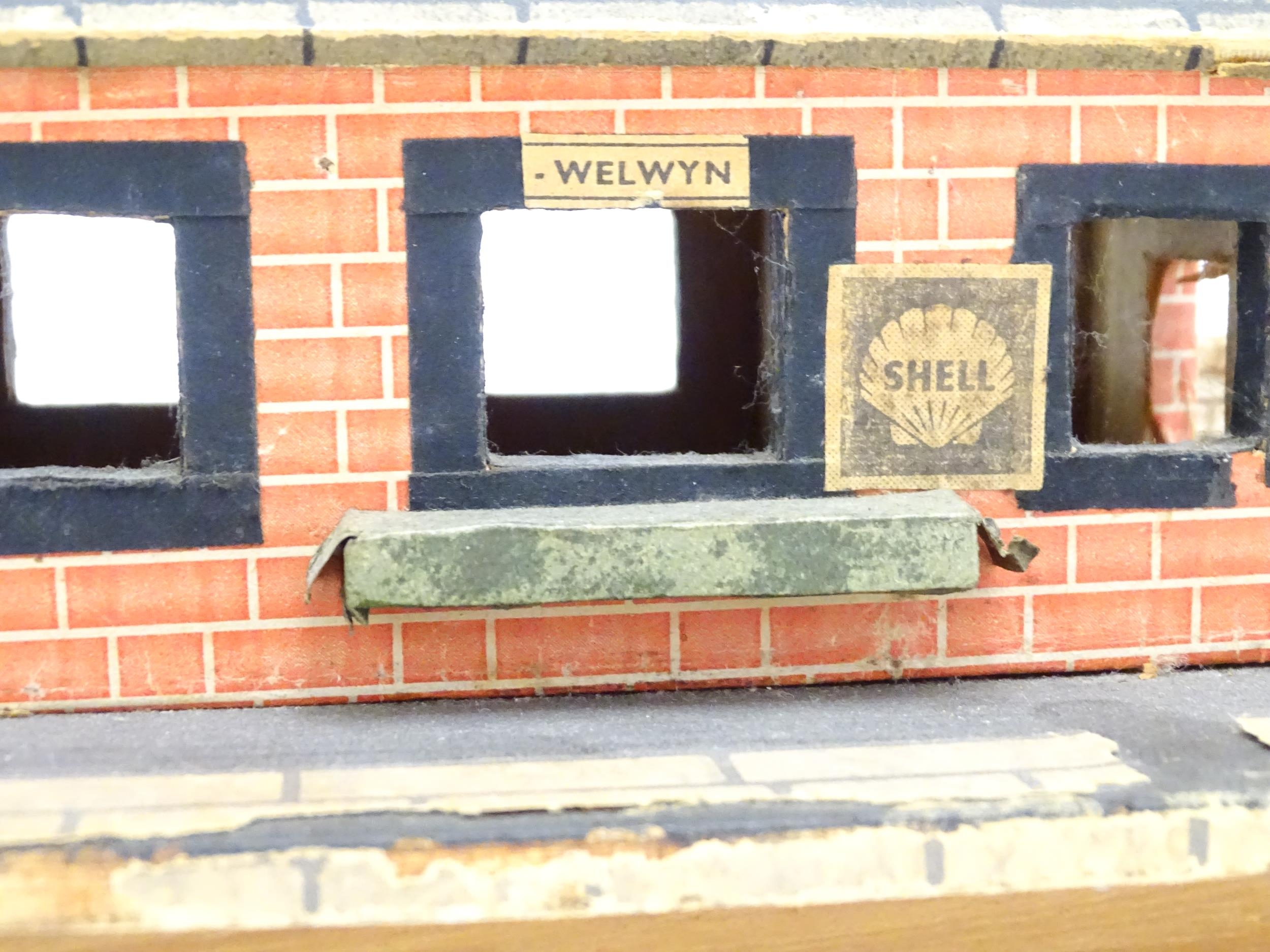 Toys: A 20thC scratch built wooden model railway station / platform with various adverts for - Bild 5 aus 10