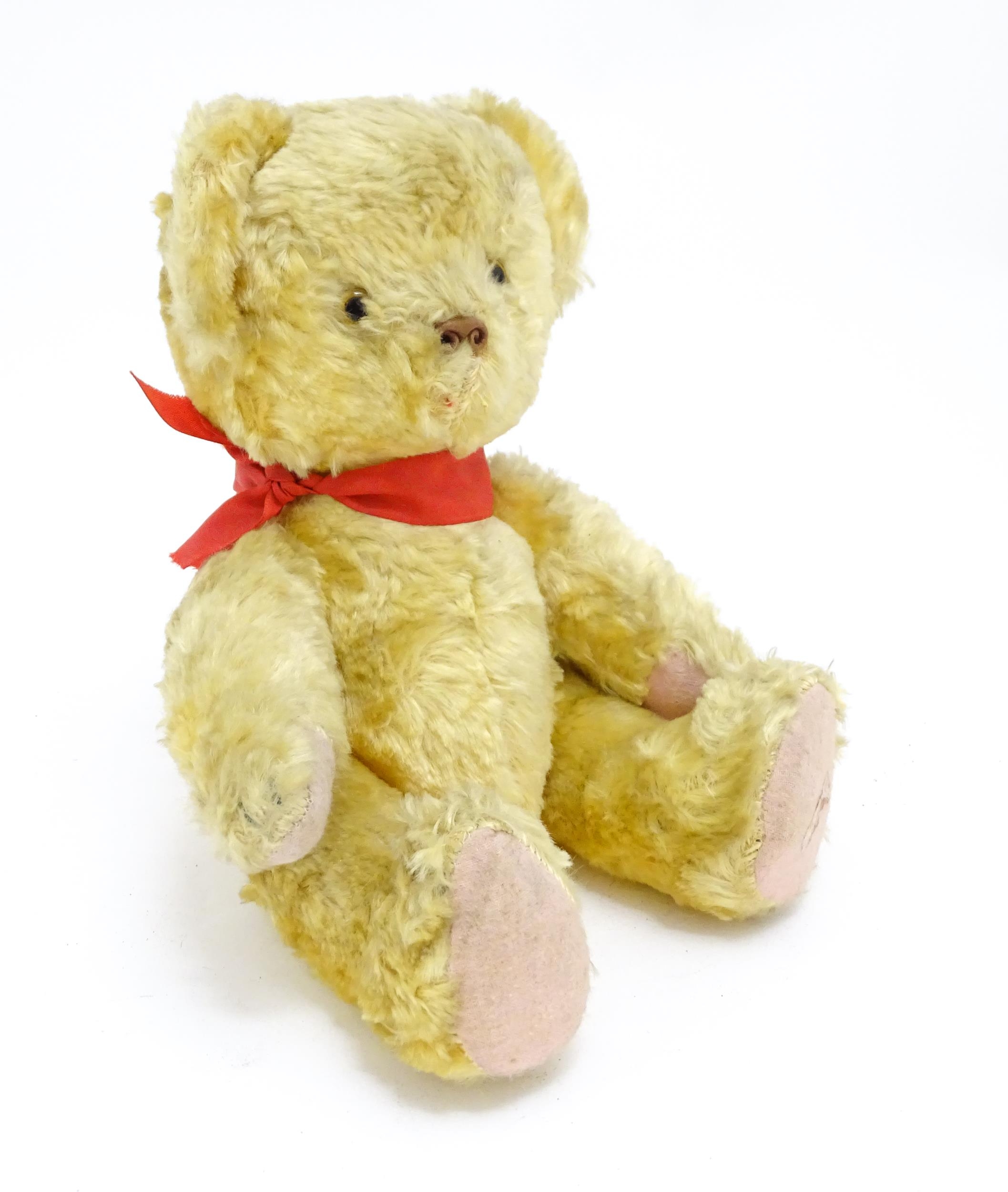 Toy: A 20thC plush teddy bear with scrolled nose, pad paws and articulated limbs. Approx. 11" long - Bild 2 aus 8