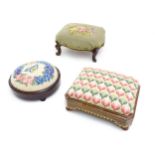 Three late 19thC / early 20thC footstools with needlework upholstered tops. The largest measuring