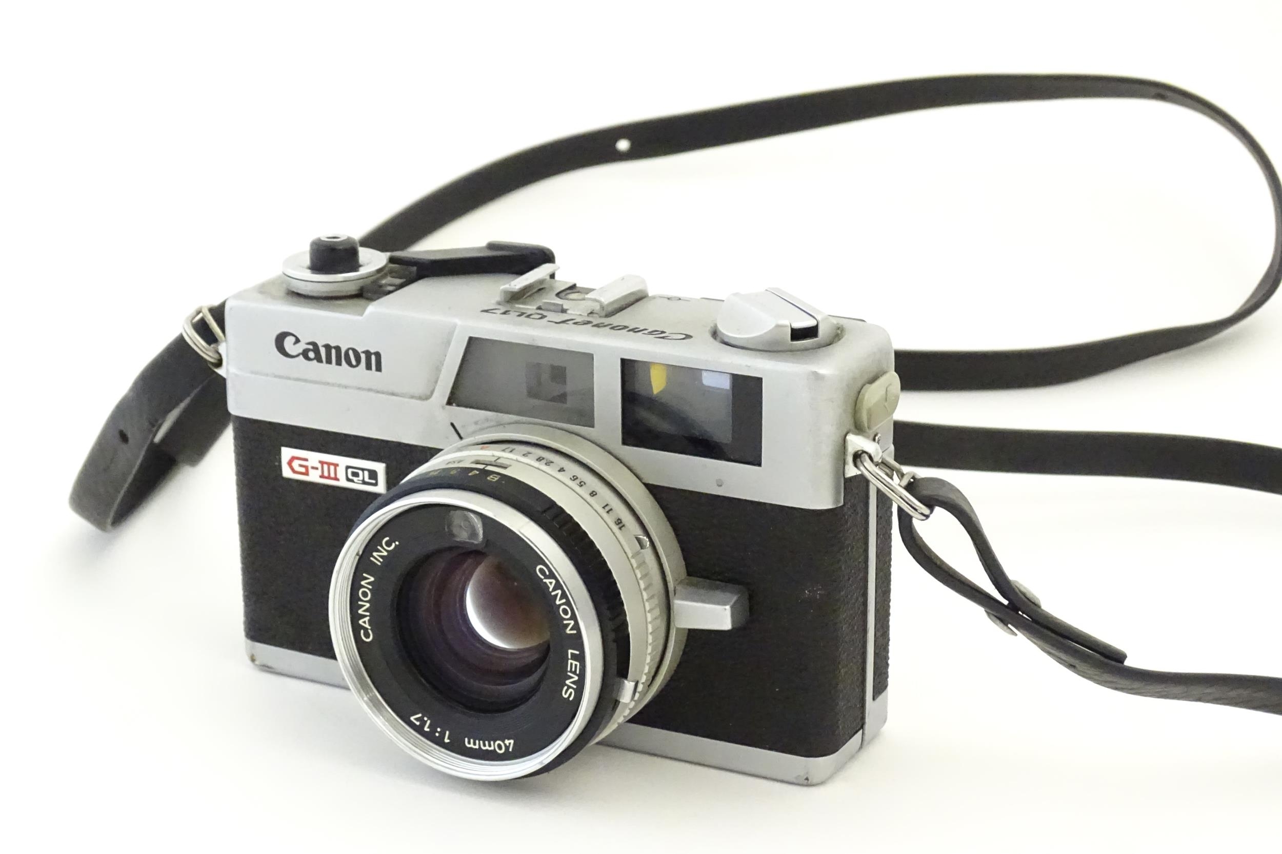 A Canon Canonet G-III QL17 35mm film camera, c1972, cased with lens cap. Approx 4 5/8" wide Please