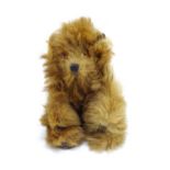 Toy: A 20thC small plush miniature model of a teddy bear. Approx. 3" long Please Note - we do not