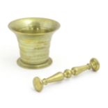 A 19thC cast brass pestle and mortar with banded detail. Approx. 3 1/2" high (2) Please Note - we do
