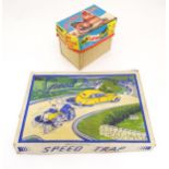 Toys: An early 20thC Lumar Toys tinplate Speed Trap clockwork game. Together with a Hen Laying