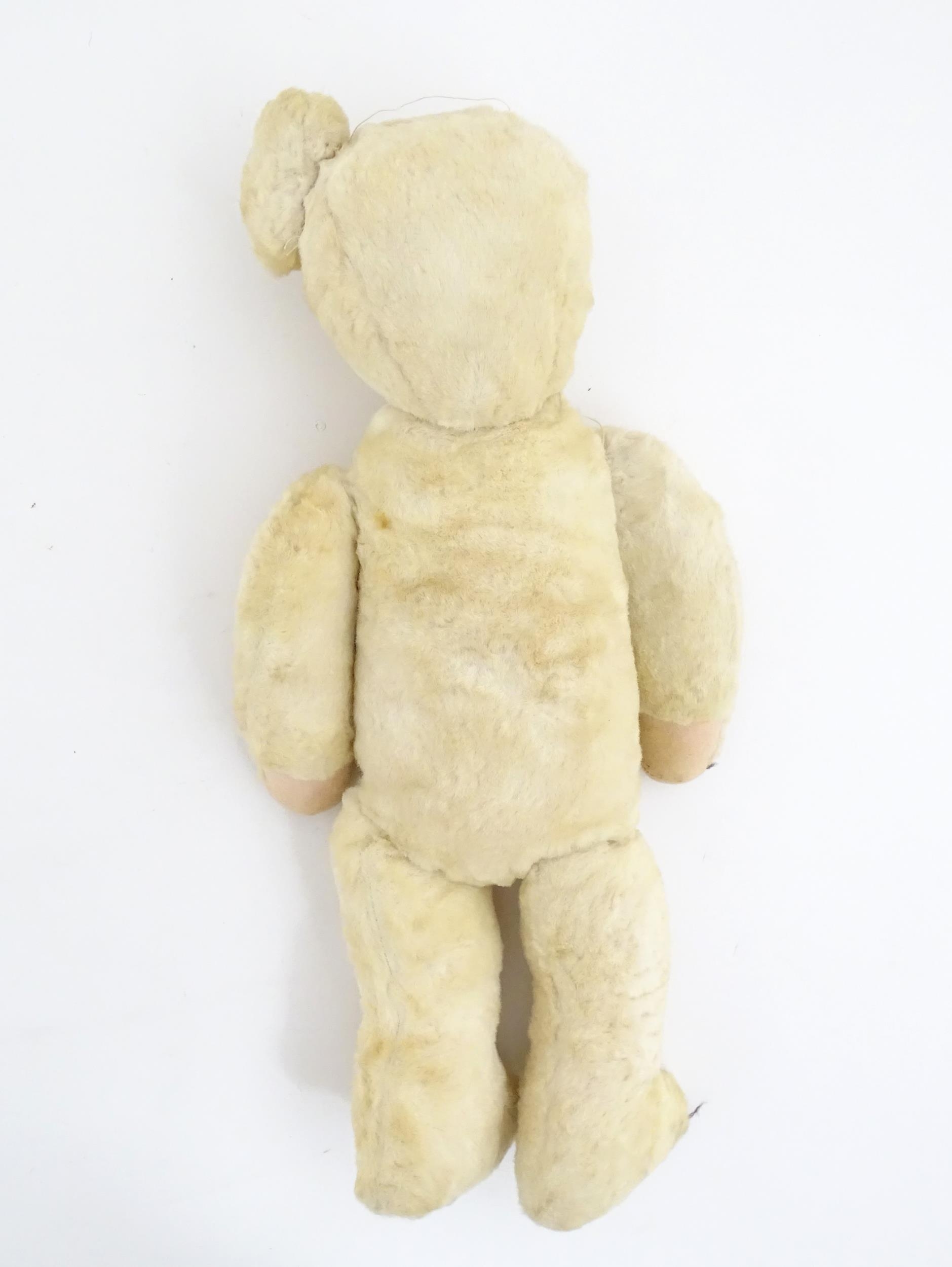 Toy: A 20thC plush teddy bear with stitched nose, mouth, eyes and paws. Approx. 19 1/2" long - Bild 2 aus 8