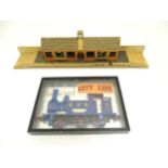 Toys: A 20thC scratch built wooden model railway station / platform with various adverts for