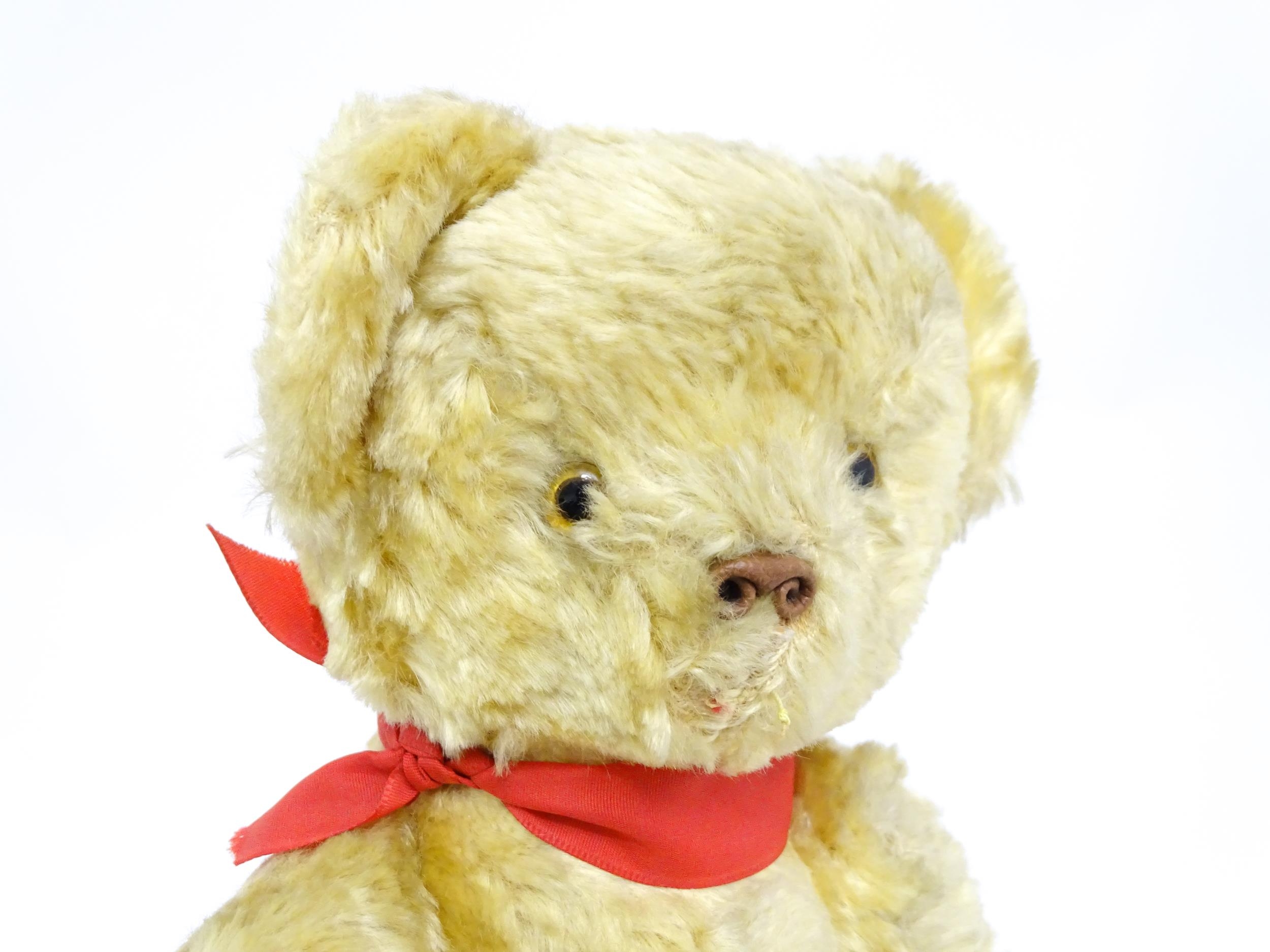 Toy: A 20thC plush teddy bear with scrolled nose, pad paws and articulated limbs. Approx. 11" long - Bild 4 aus 8