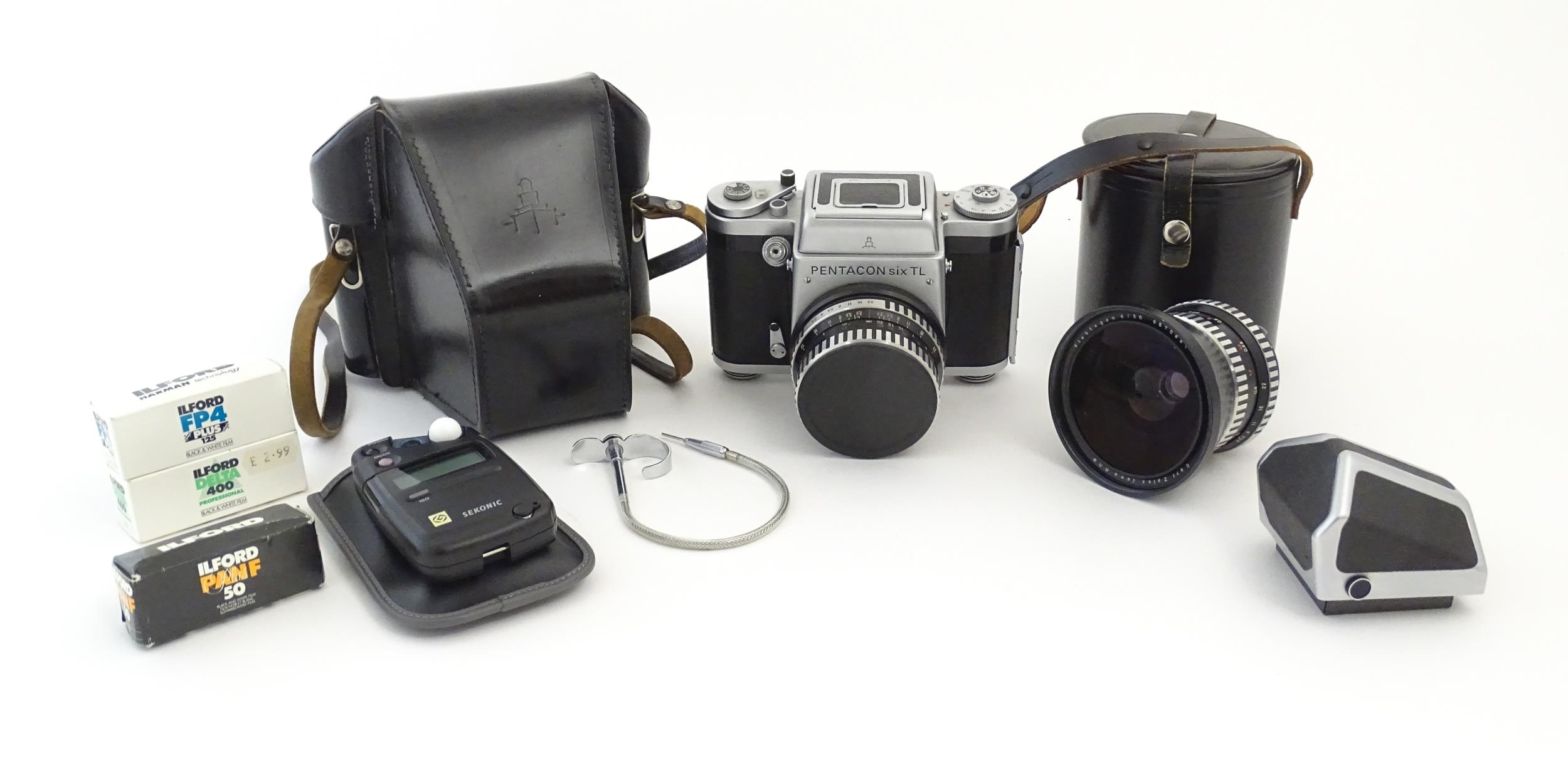 A Pentacon Six TL camera with two Carl Zeiss Jena lenses - 2.8/80 biometar and 4/50 Flektagon (