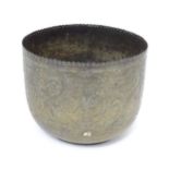 An Asian brass jardiniere / planter with engraved figural, bird, and foliate decoration and