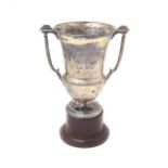 An Art Deco silver trophy cup with twin handles. Hallmarked Birmingham 1937 maker A E Poston & Co