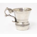 A Continental silver tot cup with scroll handle, possibly Austrian. Approx. 1 1/2" high Please