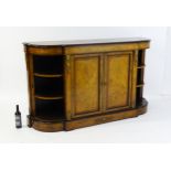 A 19thC burr walnut credenza, with an ebonised finish to the top edge and to the stepped base. The